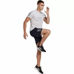 Pantalón Corto De Running Adidas Own The Run -Bicicletas comprar HB7455 APP on model walking white